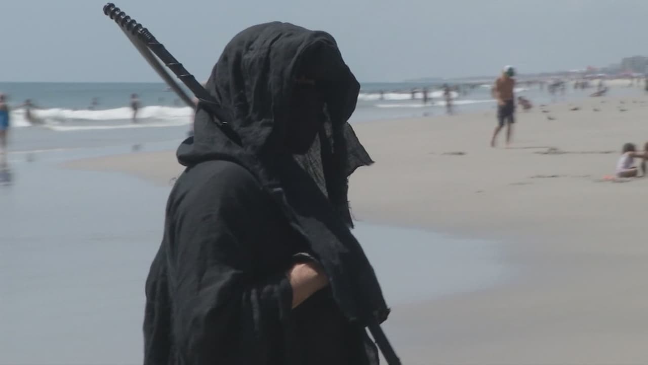 Magere Hein waarschuwt strandgangers VS voor corona