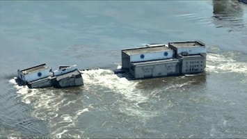 Dronebeeld toont rampgebied rond doorgebroken dam